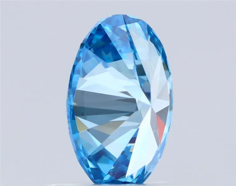 0.65ct Oval Natural Diamond (Colour Fancy Vivid Blue, Clarity VVS2, Cut EX, IGI Certified)